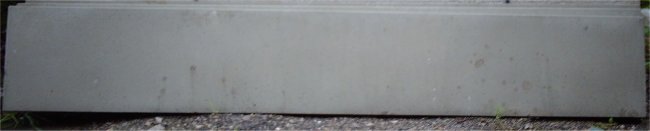 Plain grey concrete gravel board.