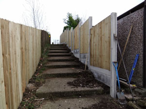 VCB fencing panel, with plain concrete bargeboards, during construction.